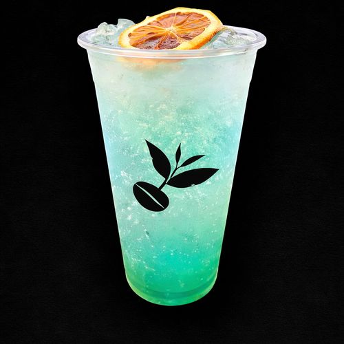Sapphire Sunrise — yuzu, Hokkaido melon and blue curaçao syrup over sparkling soda