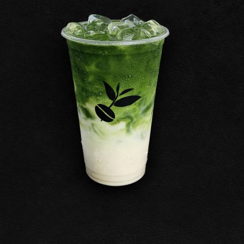 Iced Uji Matcha Latte at Charming Cafe — bright green matcha over milk in a branded cup